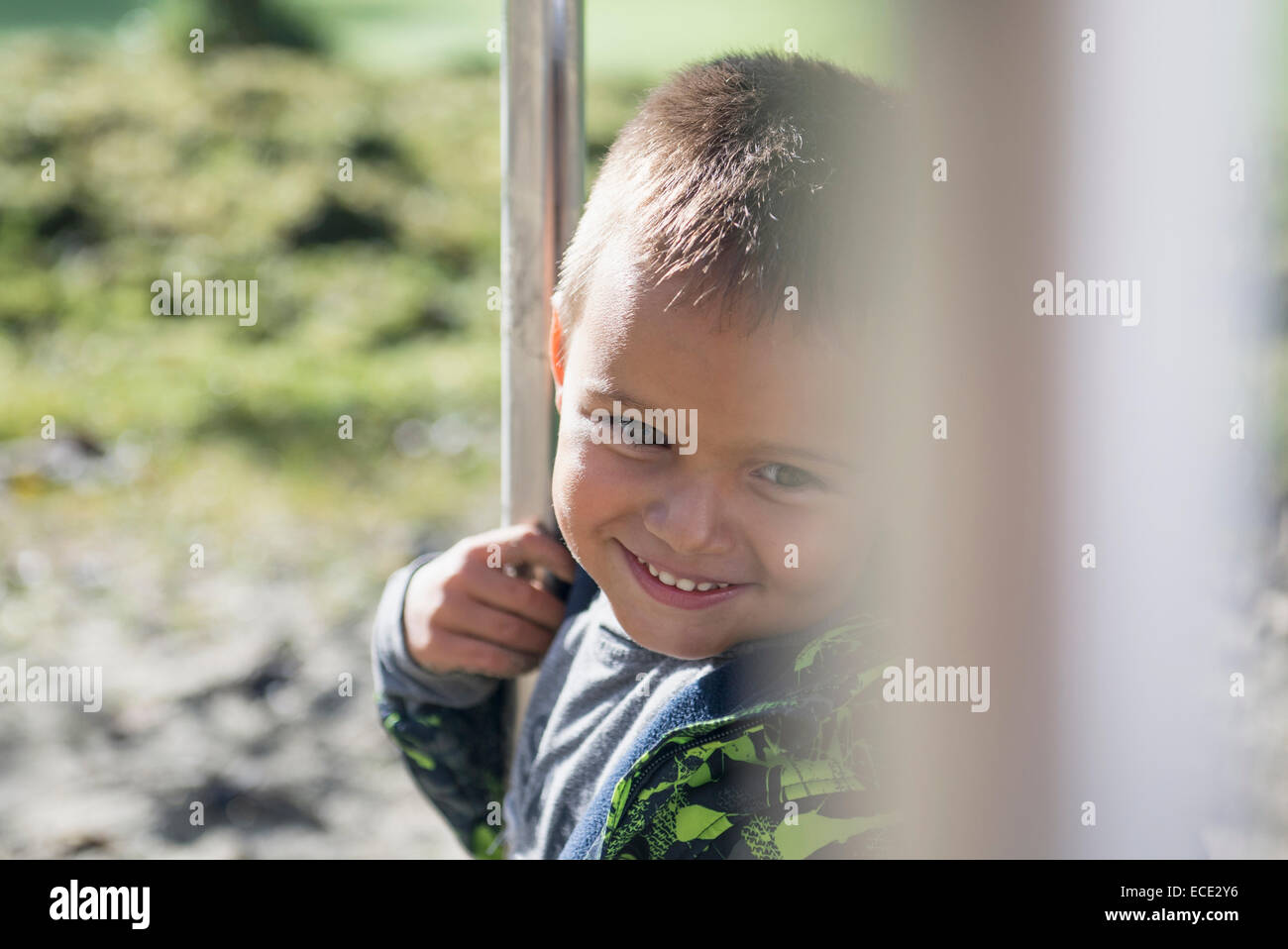Close up portrait young boy smiling playground Stock Photo - Alamy