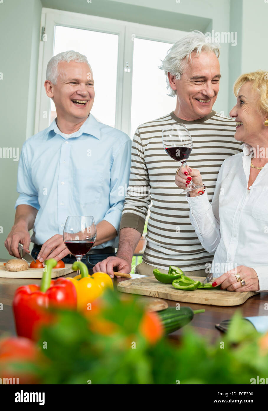 Mature woman laughing housework hi-res stock photography and images - Alamy