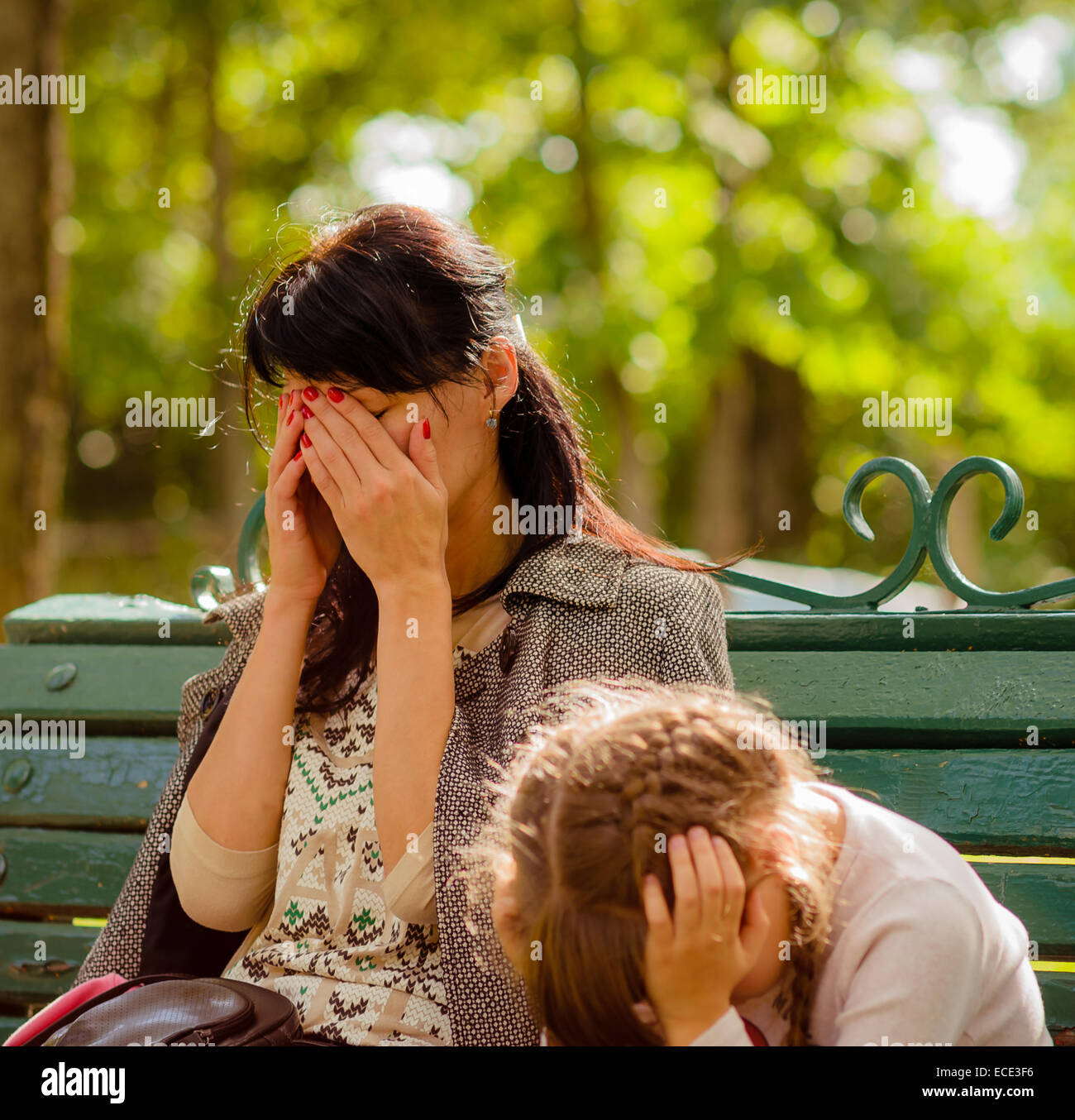 Mom and daughter thinking, in joy and sorrow, parents and children Stock Photo