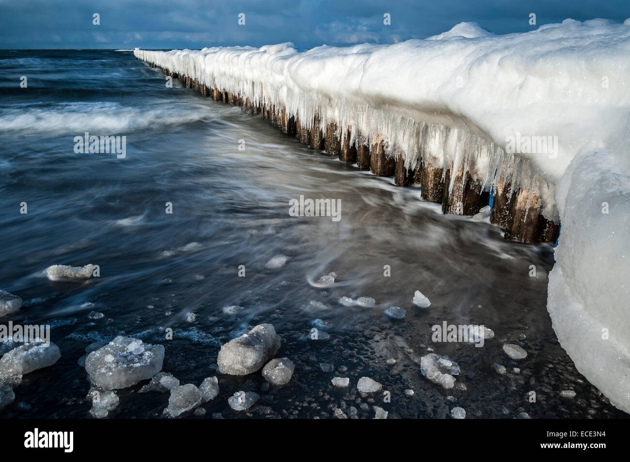 Groynes covered with snow and icicles, Baltic Sea, Zingst, Fischland-Darß-Zingst, Mecklenburg-Western Pomerania, Germany Stock Photo