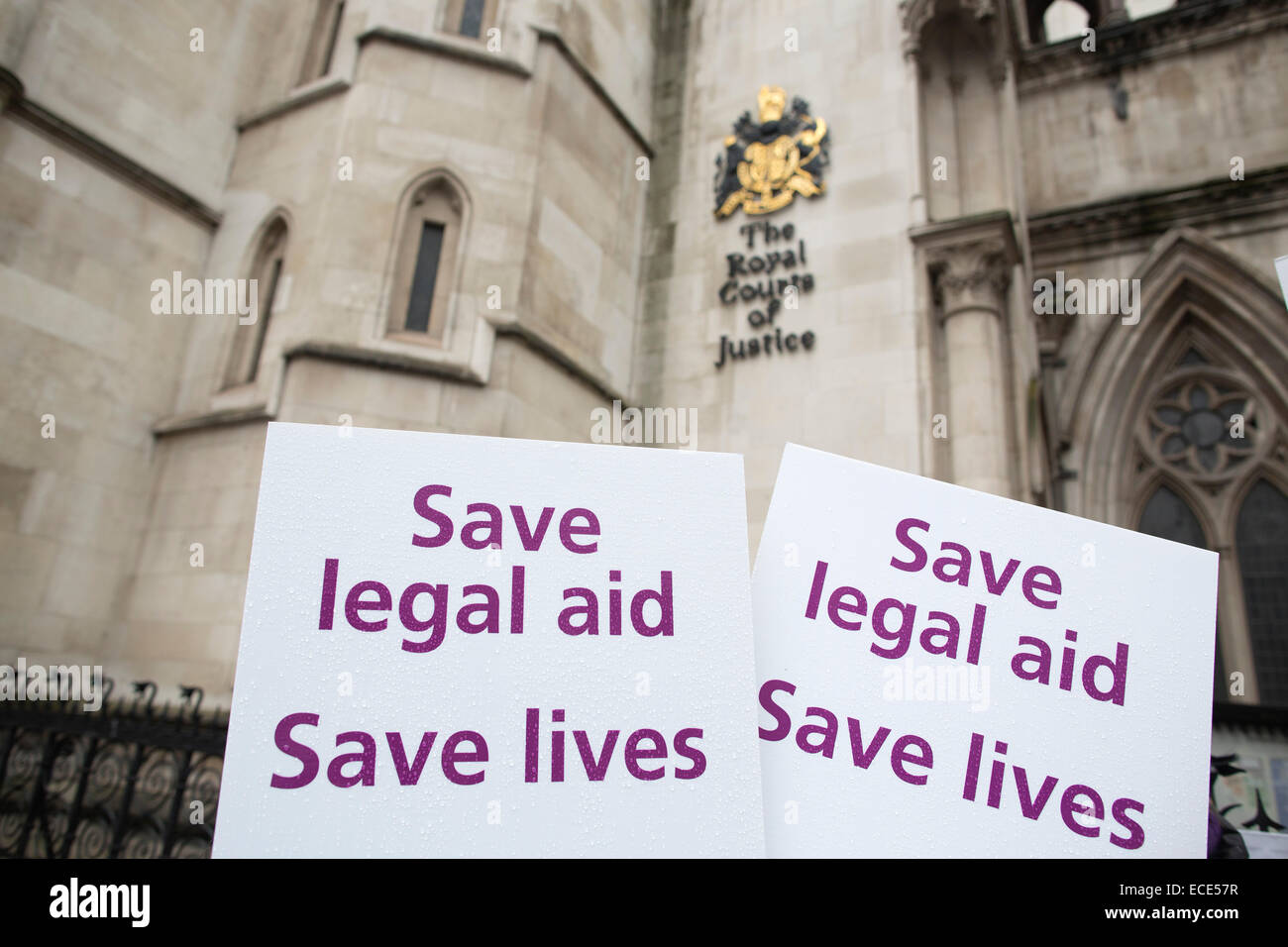 London, UK, 12th Dec, 2014. Woman's Rights Demonstration, Royal Courts of Justice, High Court, London, UK 12.12.2014 Picture shows representatives from Woman's Rights Charities demonstrating outside the Royal Courts of Justice today as a challenge is made over cuts to legal aid impacting on victims of domestic violence. Credit:  Jeff Gilbert/Alamy Live News Stock Photo