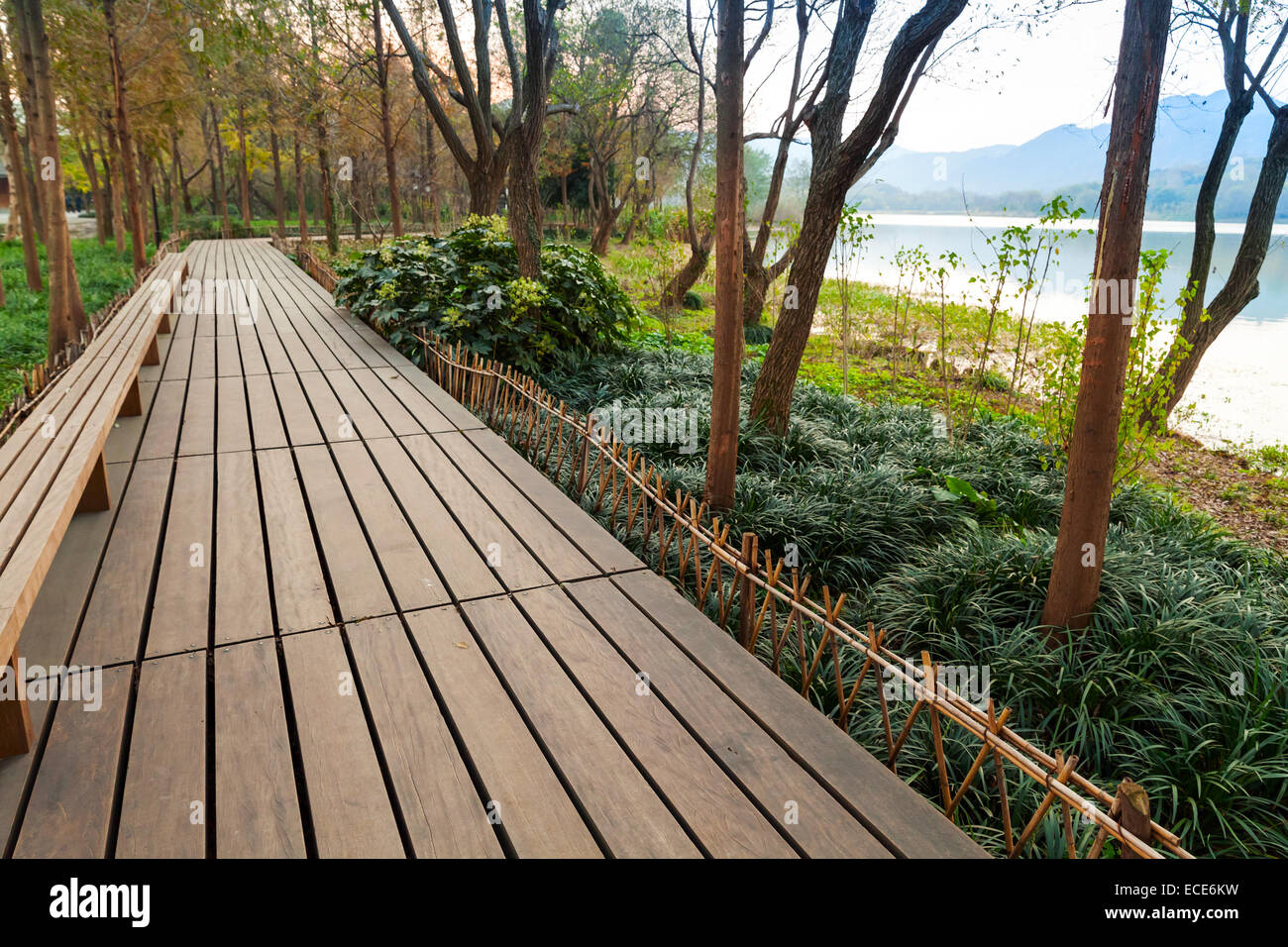 Wooden pathway. Walking around famous West Lake park in Hangzhou city center, China Stock Photo