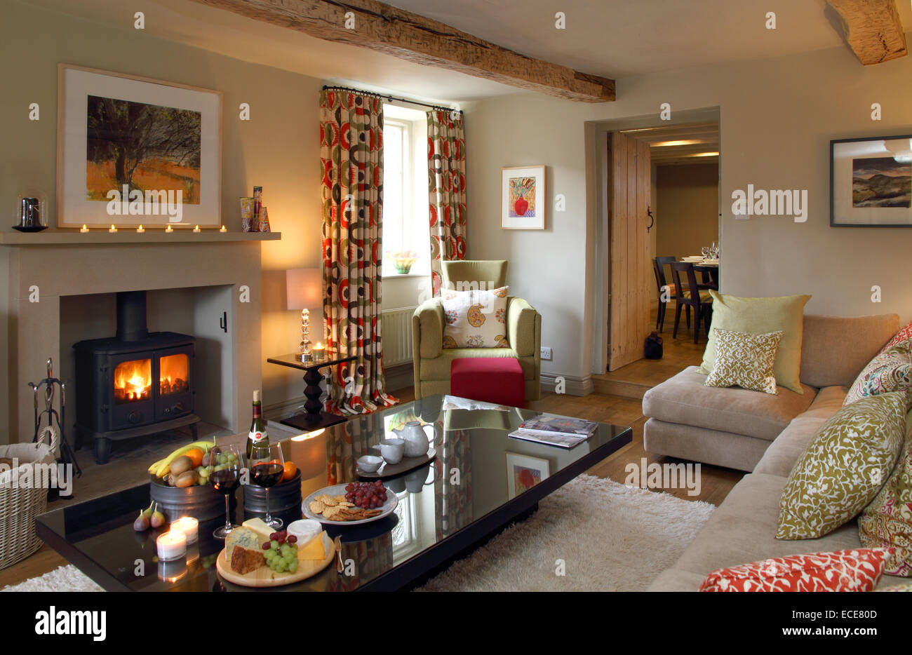 Cosy living/sitting room with fire. Stock Photo