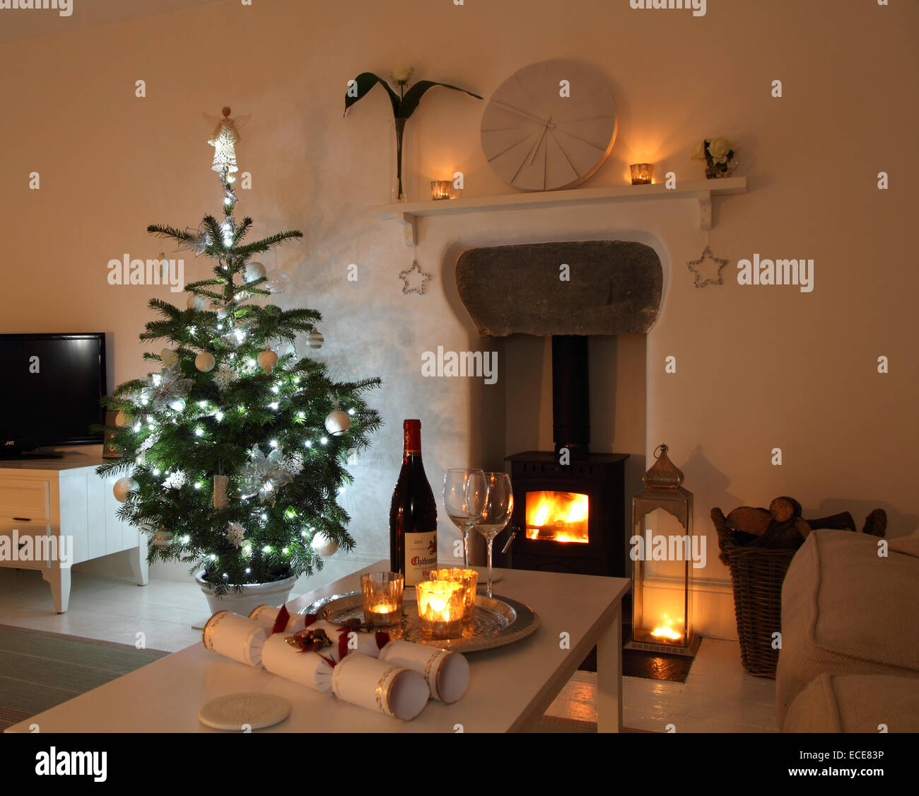 Cosy living/sitting room with fire. Stock Photo