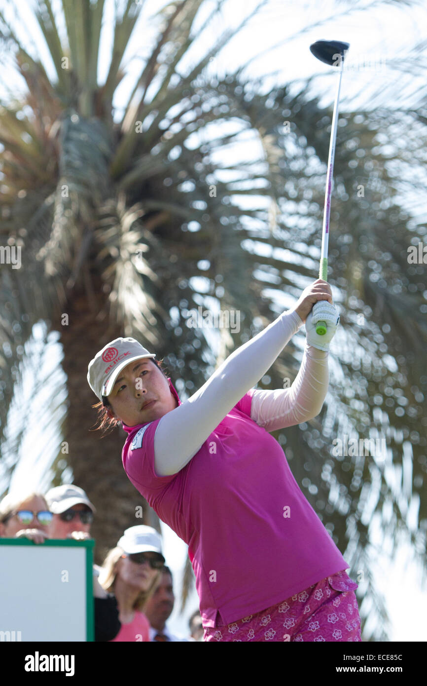 Dubai. 12th December, 2014. Shanshan Feng of China plays from the second tee during the third round of the Omega Dubai Ladies Masters 2014. Credit:  Alexander Atack/Alamy Live News Stock Photo