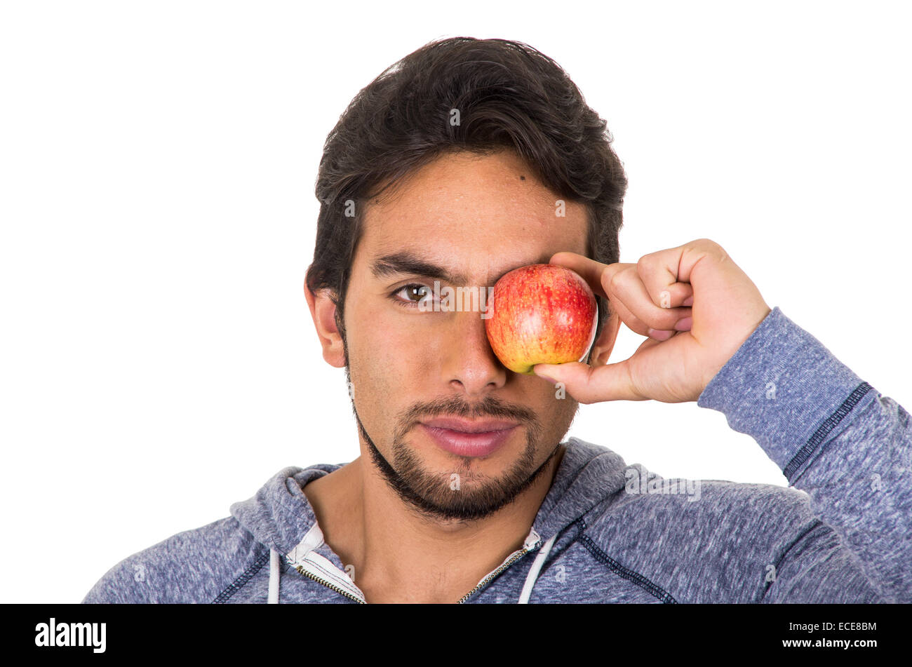 handsome young man holding red apple Stock Photo - Alamy