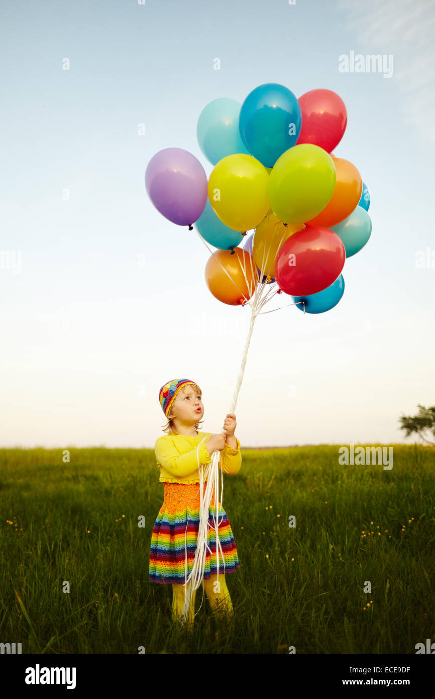 little girl with colorful balloons Stock Photo - Alamy