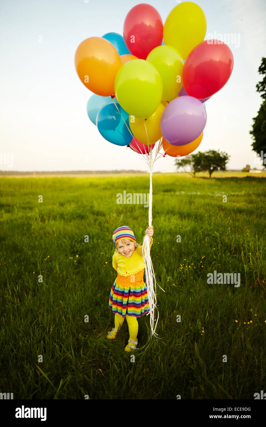 little girl with colorful balloons Stock Photo Alamy