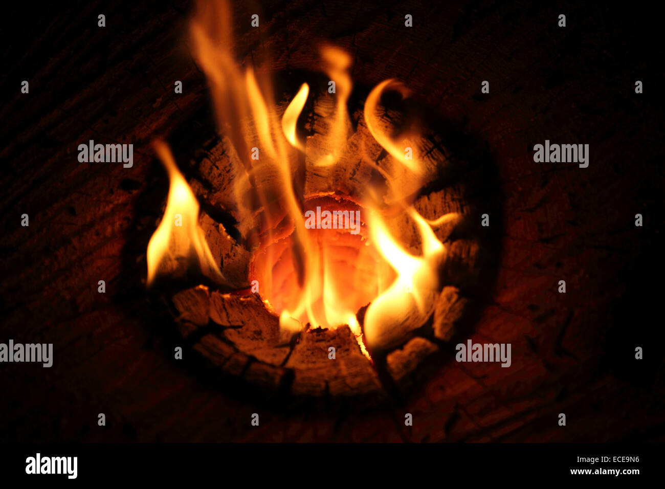 Flames in a wood at Zuers, Austria. The wood burns at a traditional Christmas market. Stock Photo