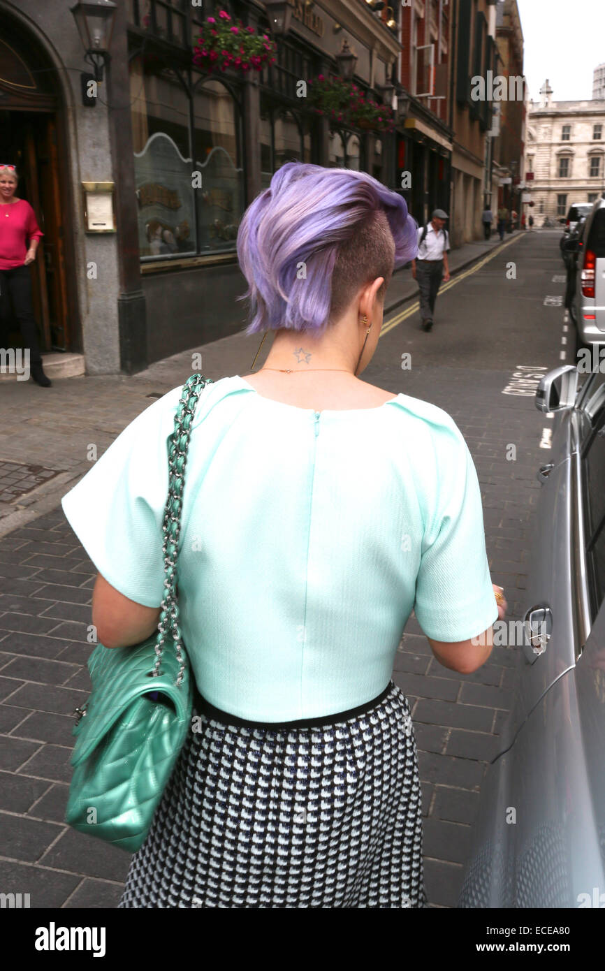 leoniehanne wearing Chanel SS2020 purple square flap bag & The Pangaia  purple track pants