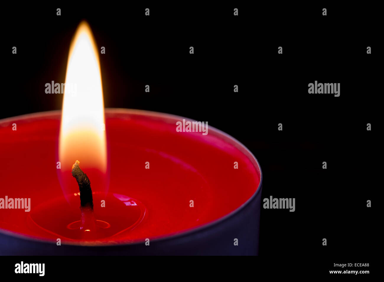 Dark glowing red tea light Stock Photo Alamy