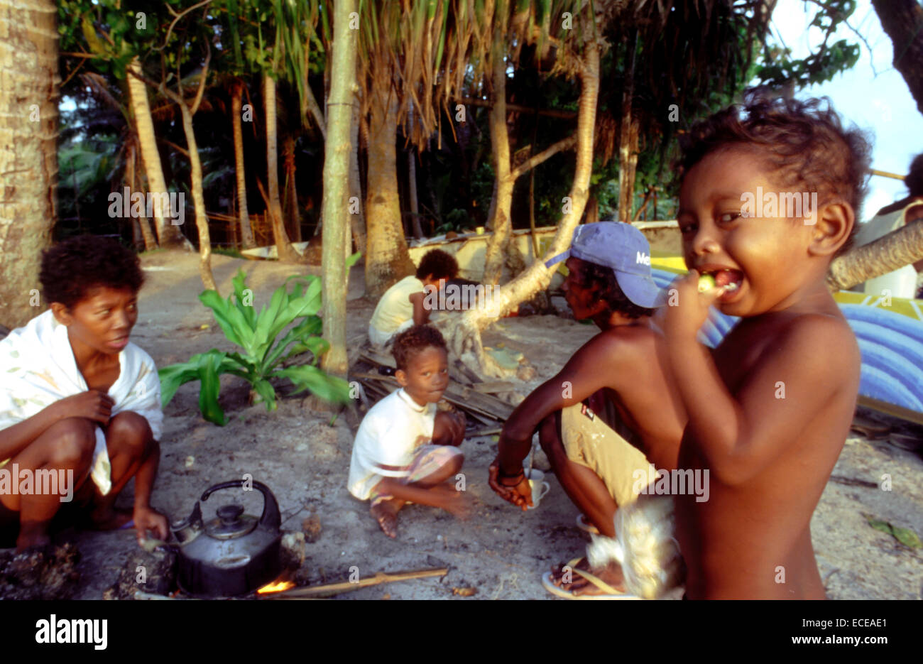 Family of fishermen. Preparing breakfast. Bulabog beach. Boracay.  Philippines. Boracay is a small island in the Philippines loc Stock Photo
