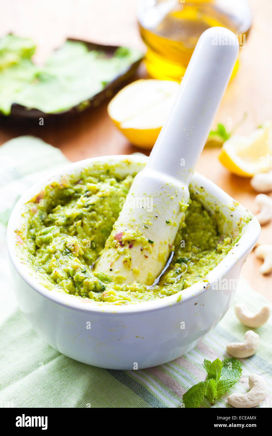 Avocado and cashew nut pesto in a mortar and pestle Stock Photo Alamy