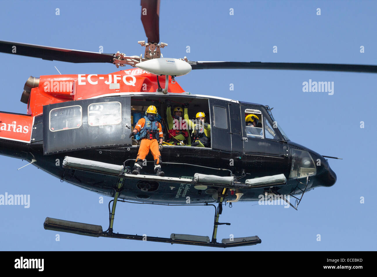 Spanish coastguard helicopter taking part in rescue services simulation on beach in Spain Stock Photo