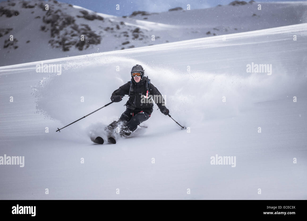 Austria, Front view of free ride skier downhill skiing Stock Photo