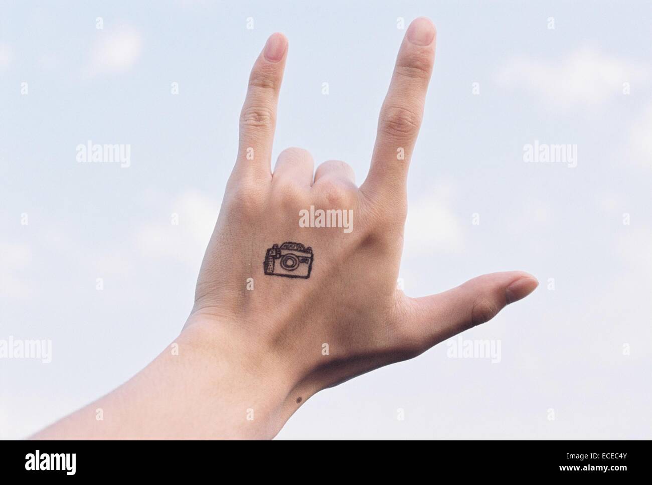Hand With Camera Tattoo Making I Love You Sign Stock Photo Alamy Hand With Camera Tattoo Making I Love You Sign Stock Photo Alamy