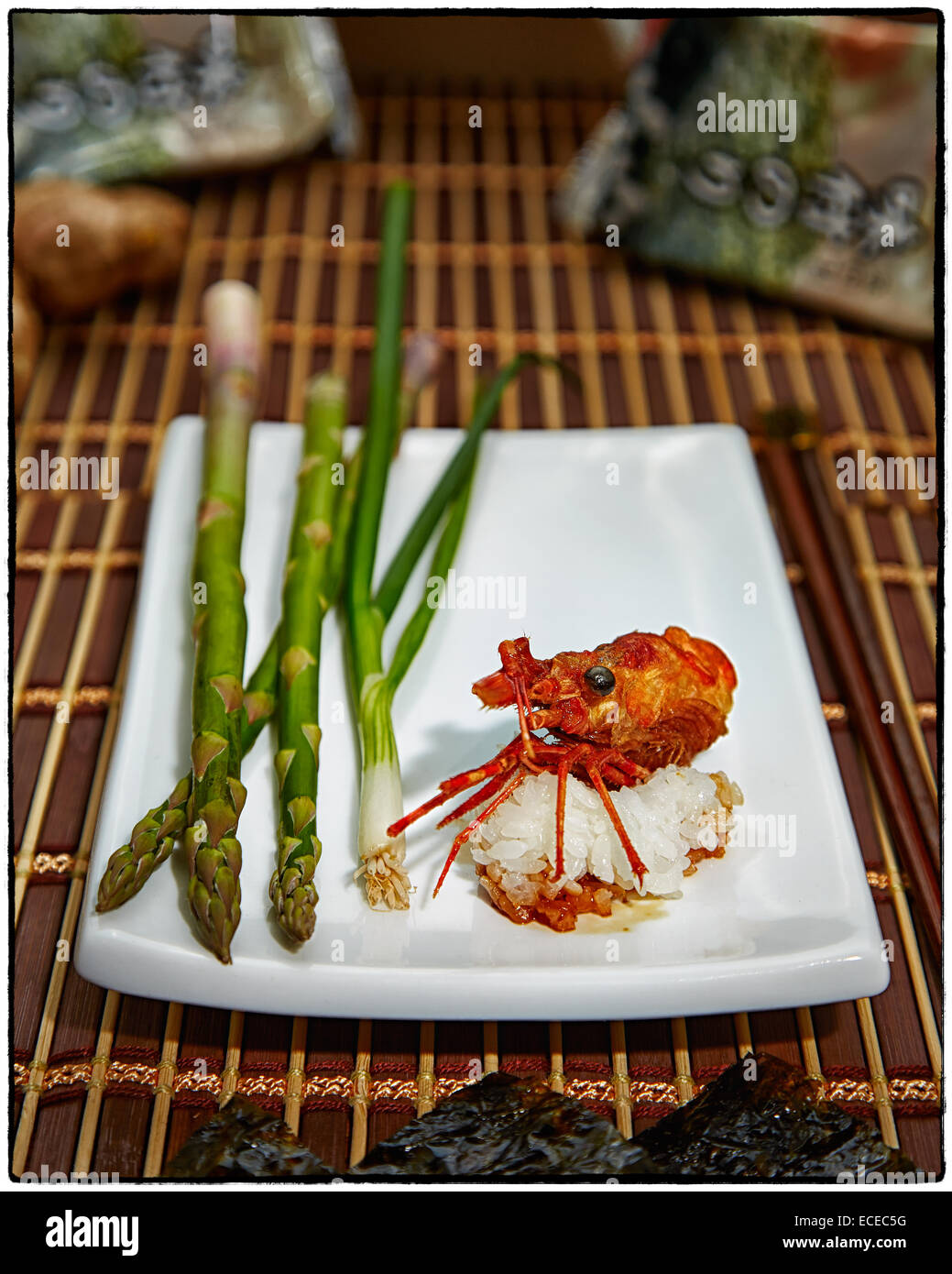 Deep fried shrimp head served with rice, asparagus, and green onions Stock Photo