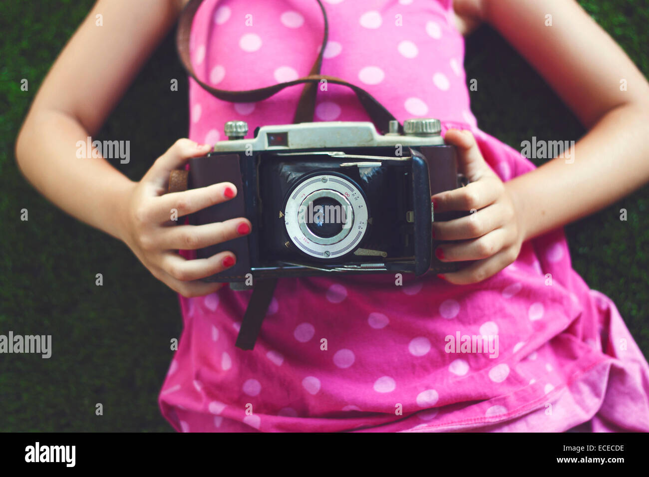 Girl holding vintage camera Stock Photo