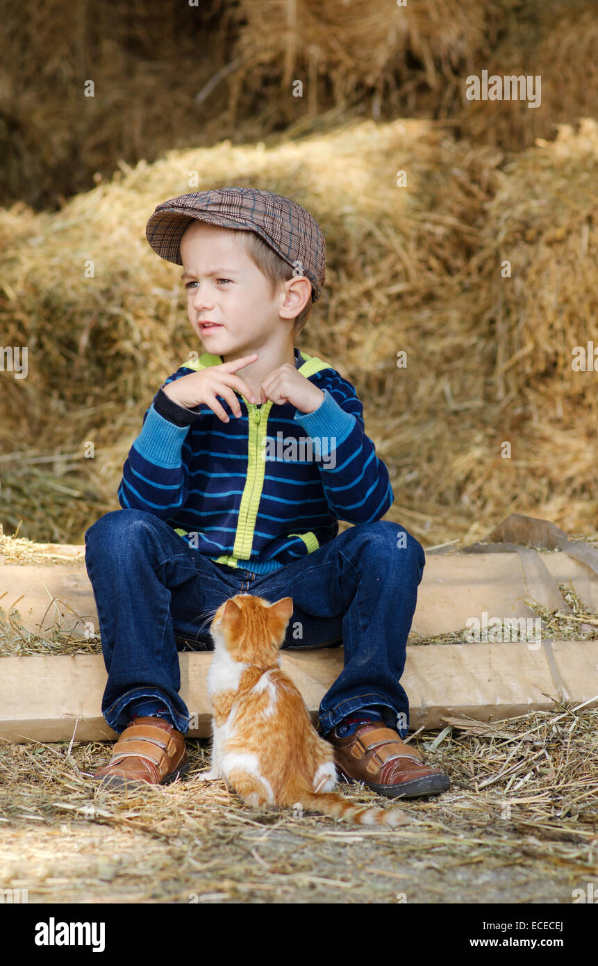 Little boy (4-5) with kitten Stock Photo