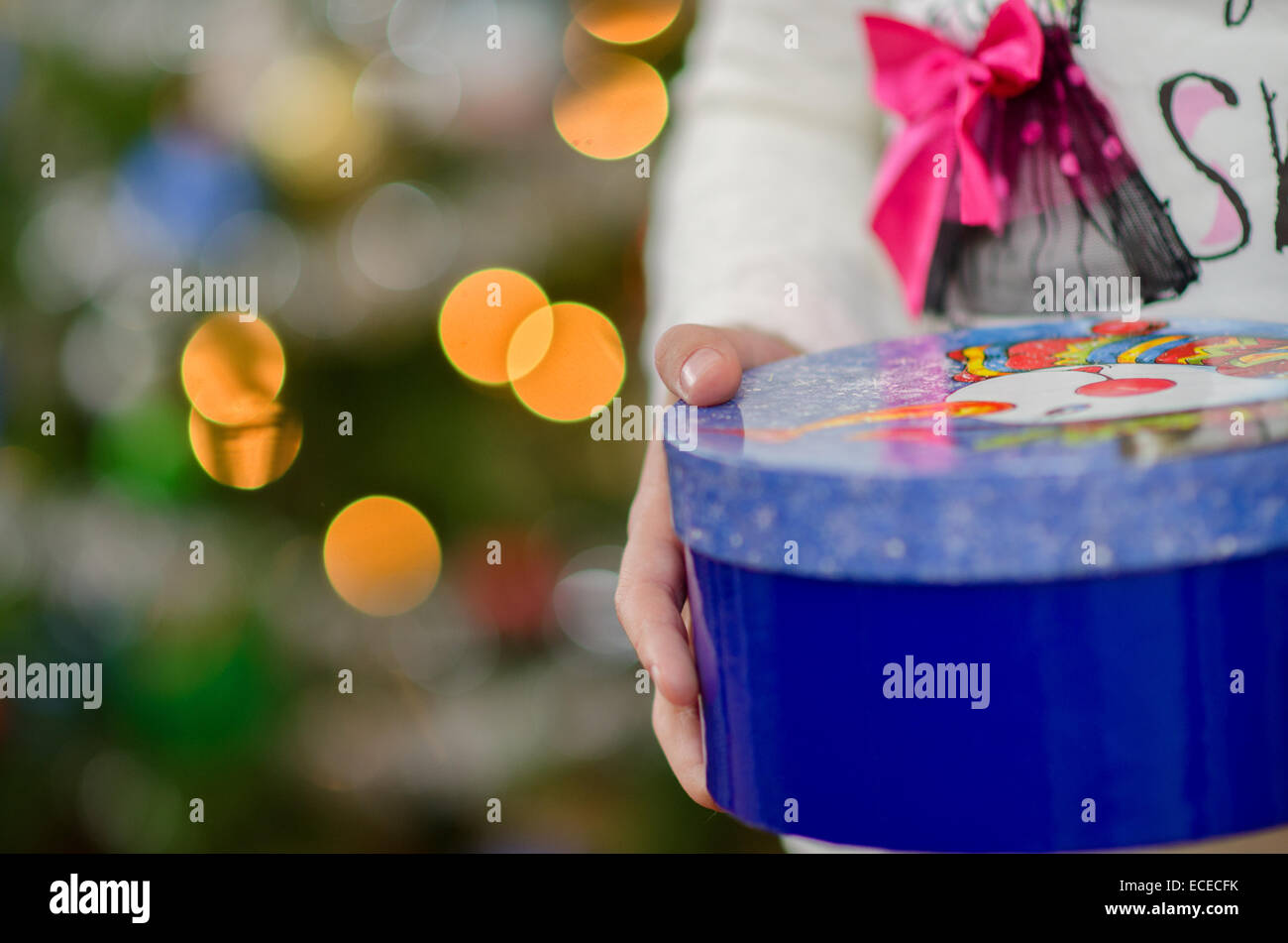 Person holding christmas present Stock Photo