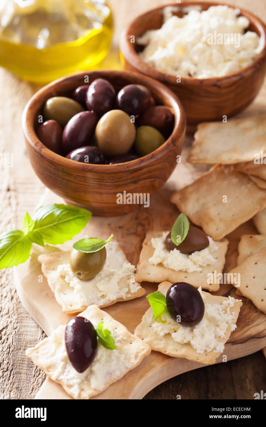 crackers with soft cheese and olives. healthy appetizer Stock Photo Alamy