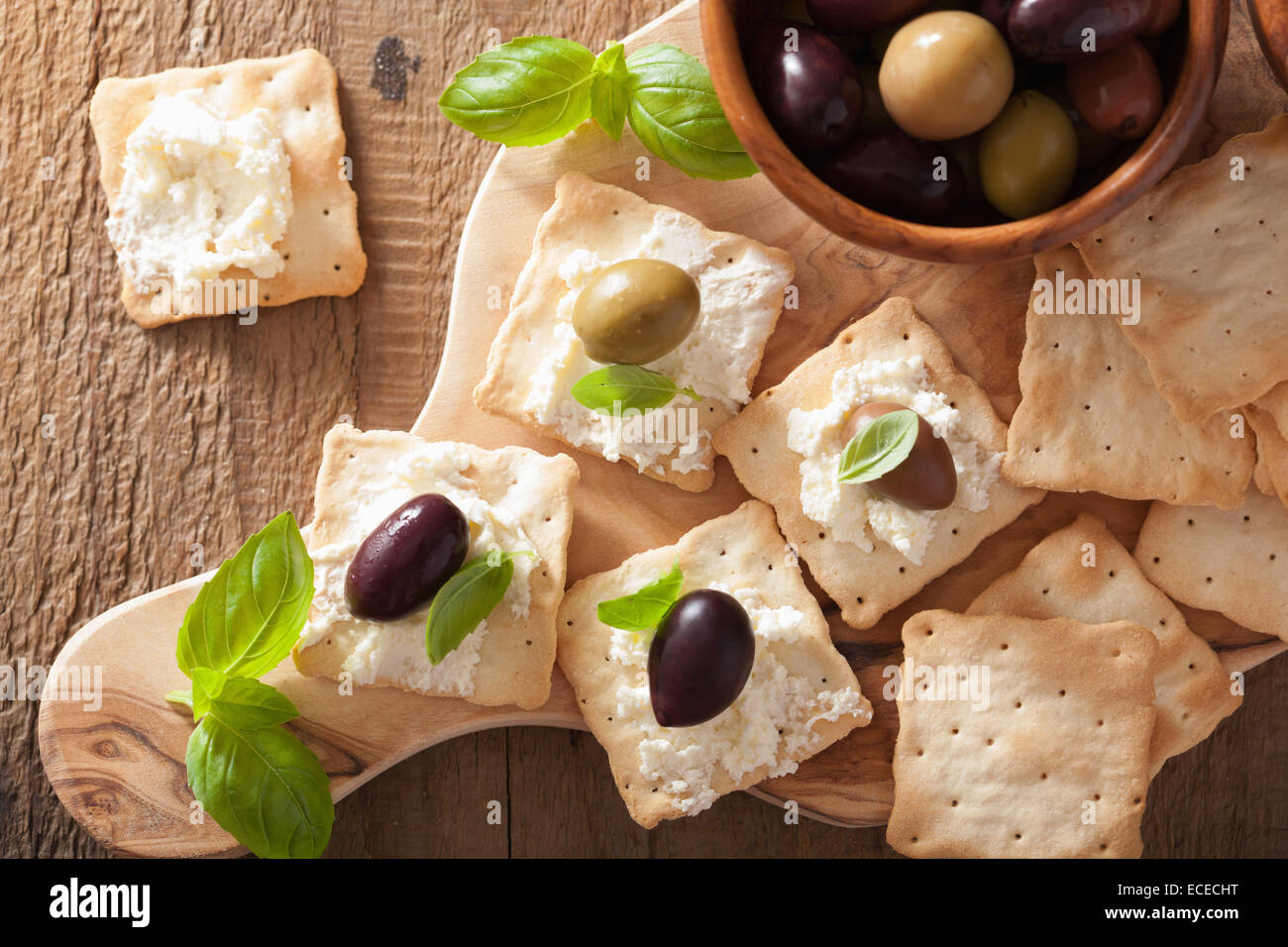 crackers with soft cheese and olives. healthy appetizer Stock Photo Alamy