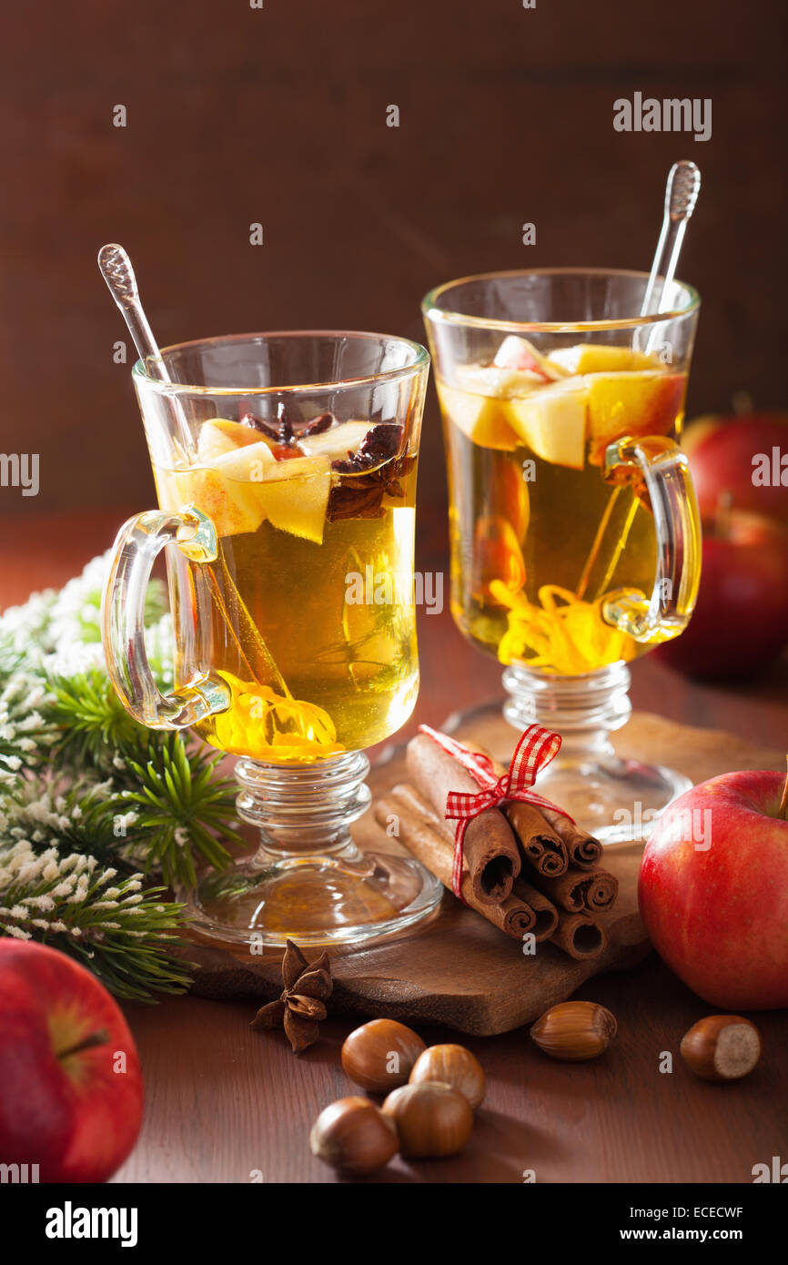 glass of mulled apple cider with orange and spices, christmas decoration Stock Photo