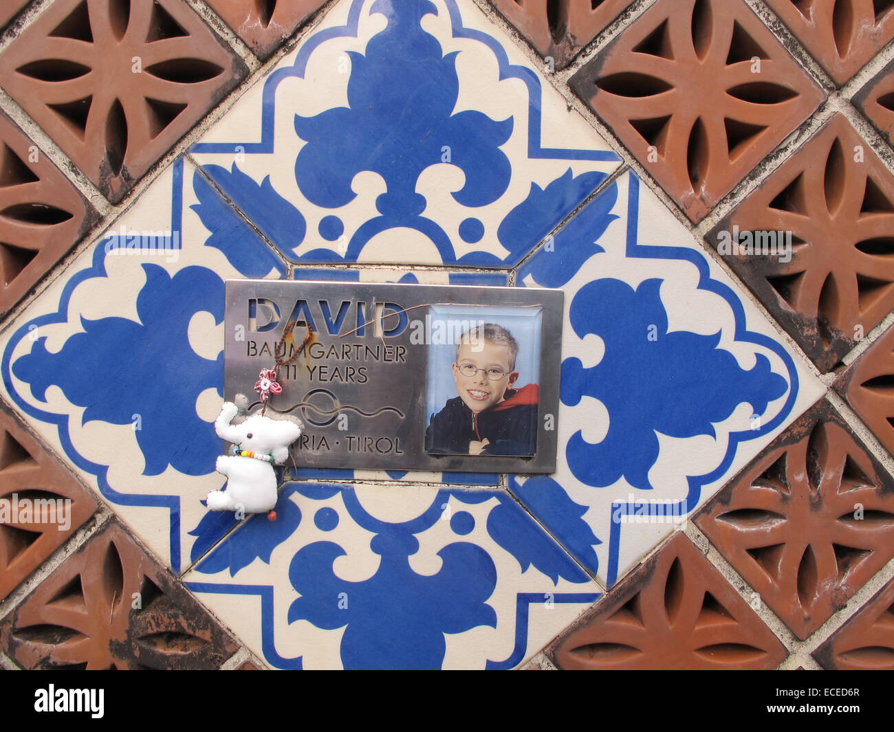 A tile with a photo of Daniel from Austria, who was killed at the age of 11 at the tsunami monument in Ban Nam Khem, Thailand, 20 November 2014. Relatives have placed tiles there in memory of their loved ones. More than 8,000 people were killed in the region. Photo: CHRISTAINE OELRICH/dpa Stock Photo