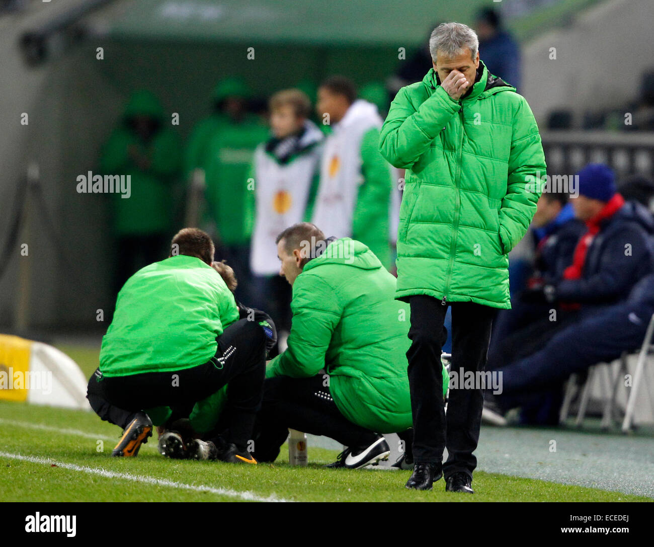 Gladbach's head coach Lucien Favre (R) turns away from injured Christoph Kramer during the Europa League group A soccer match between Borussia Moenchengladbach and FC Zuerich in Moenchengladbach, Germany, 11 December 2014. Photo: Roland Weihrauch/dpa Stock Photo