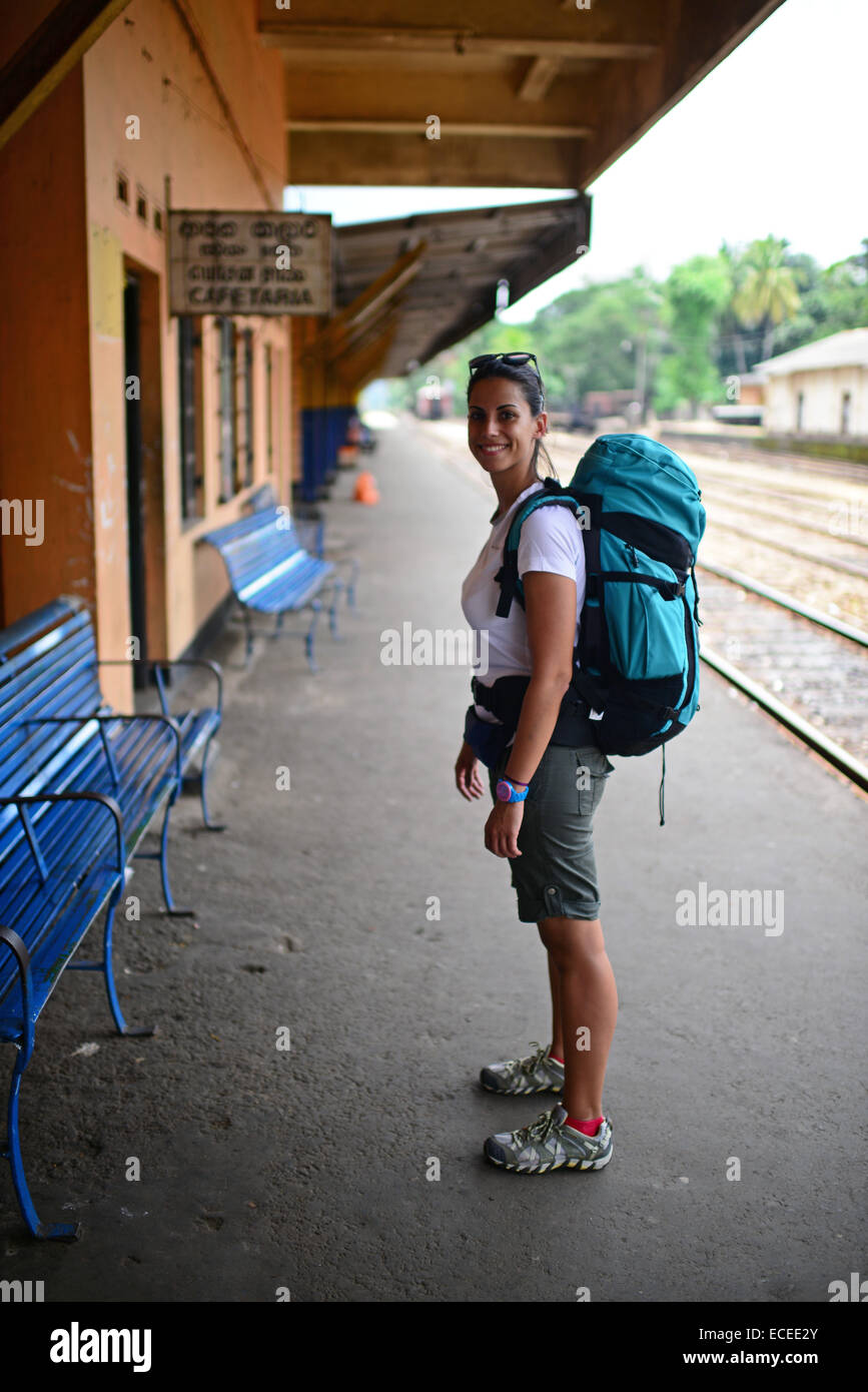 Young attractive female backpacker in Rambukkana train station, Sri