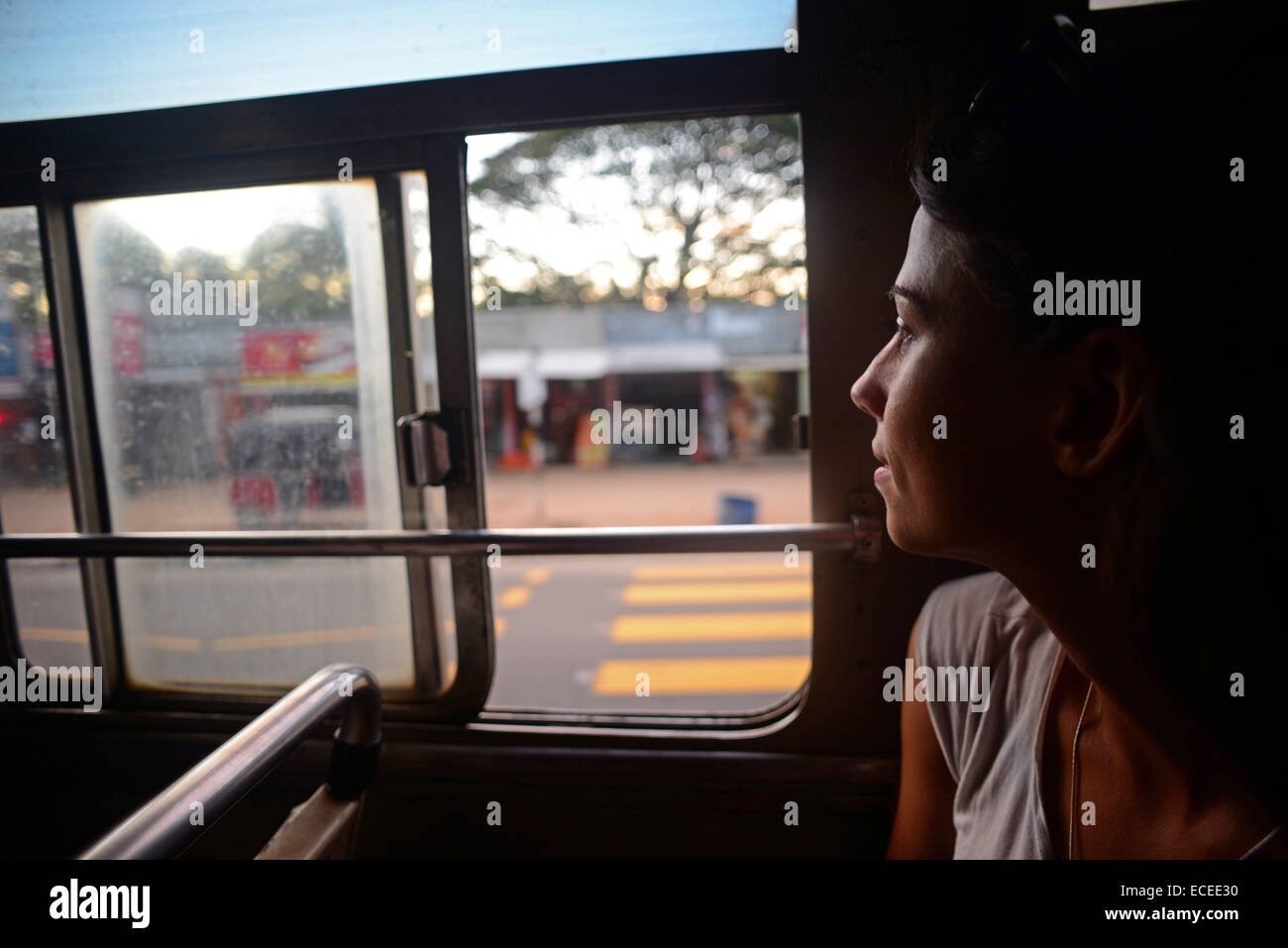 Young woman watches through window in bus, Sri Lanka Stock Photo Alamy