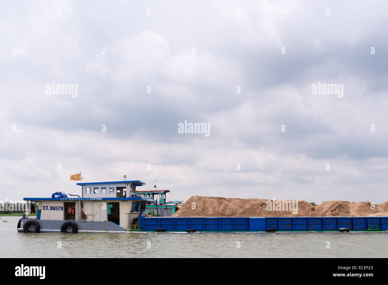 overloaded cargo boat - Mekong Delta, Vietnam Stock Photo