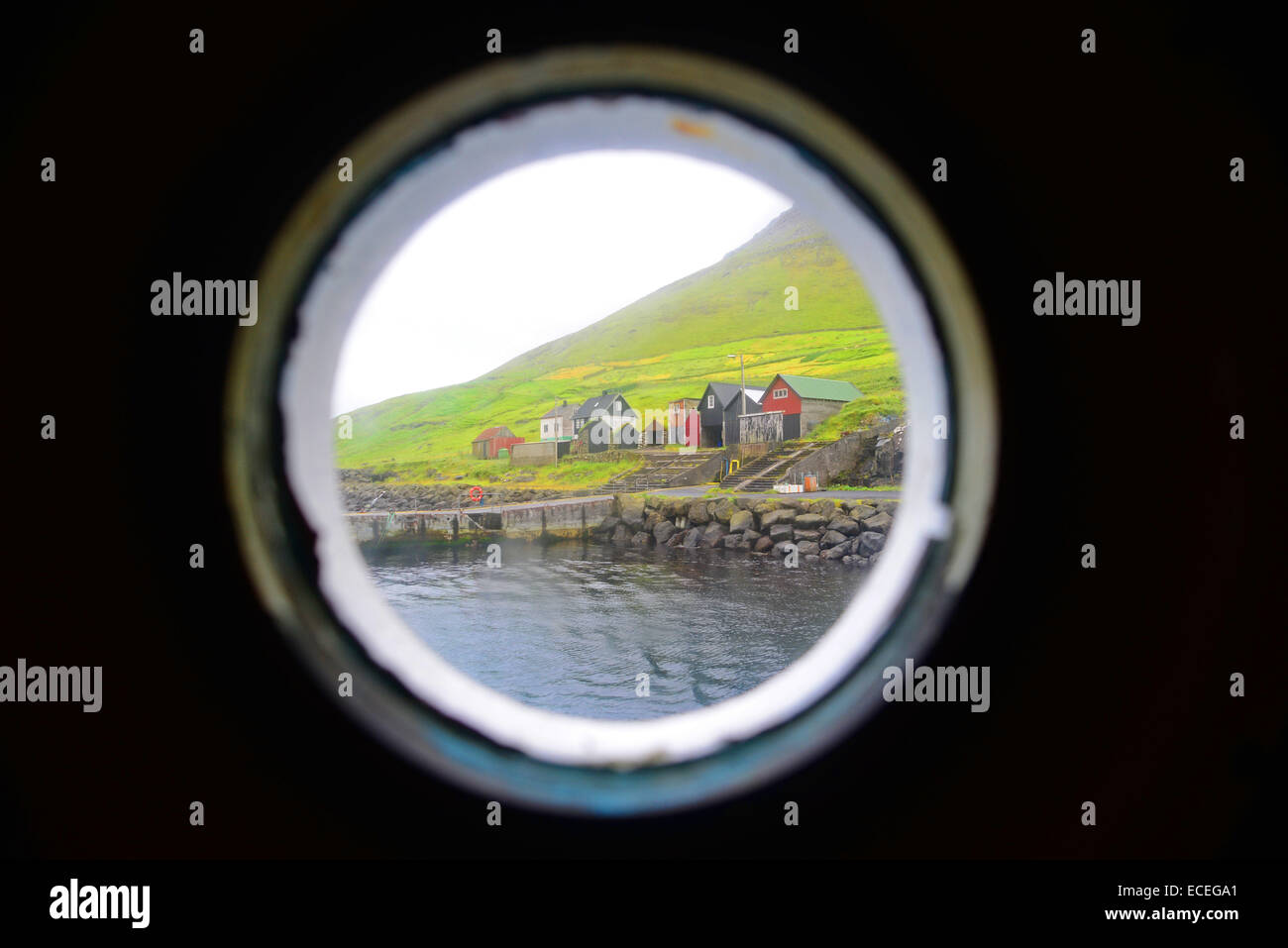 View from rounded window of Sam, ferry from Klaksvík to Syðradalur (Kalsoy) Stock Photo