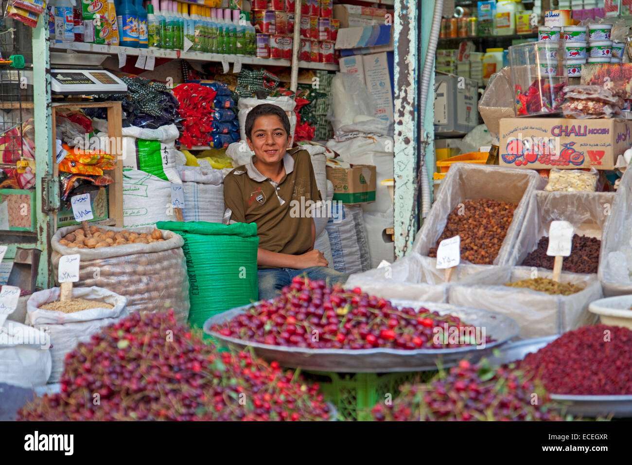 Iranian child selling groceries at food market in the city Gorgan / Gurgan, Golestan Province, Iran Stock Photo