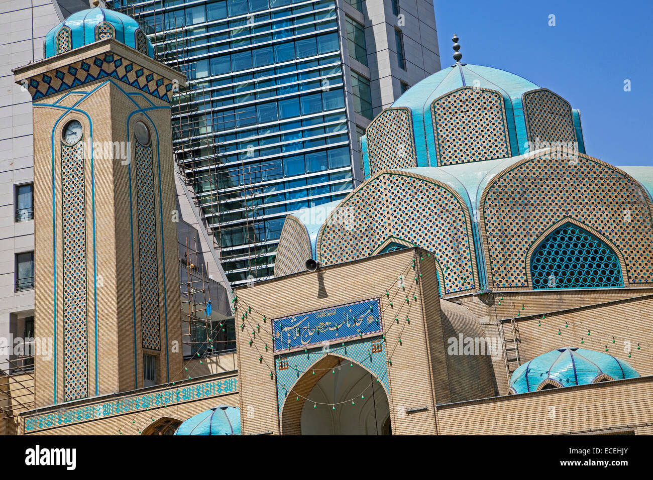 Mosque in front of modern apartment in the city Mashhad, Razavi Khorasan, Iran Stock Photo