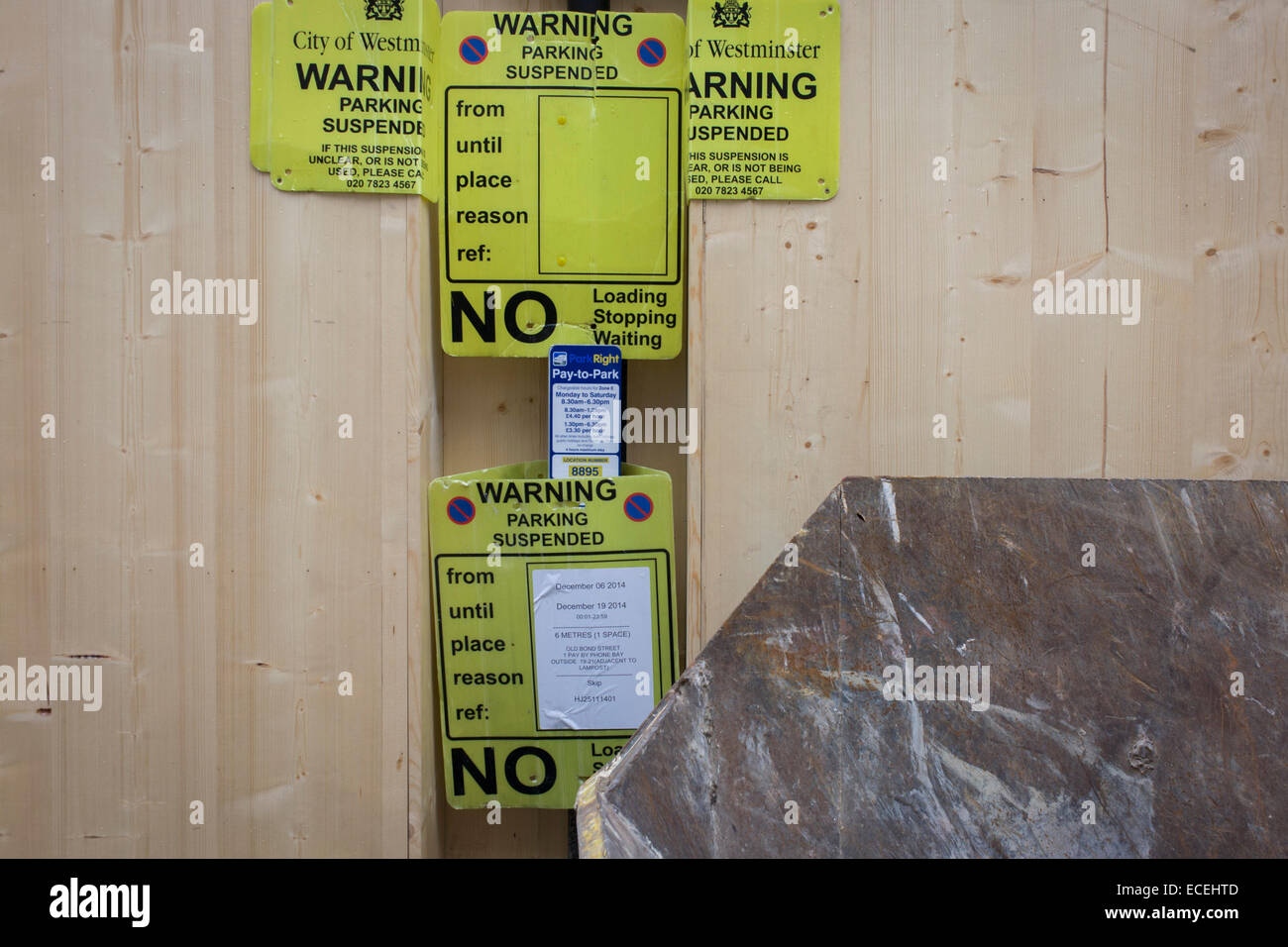 parking-suspension-signs-attached-to-construction-hoardings-in-london-s