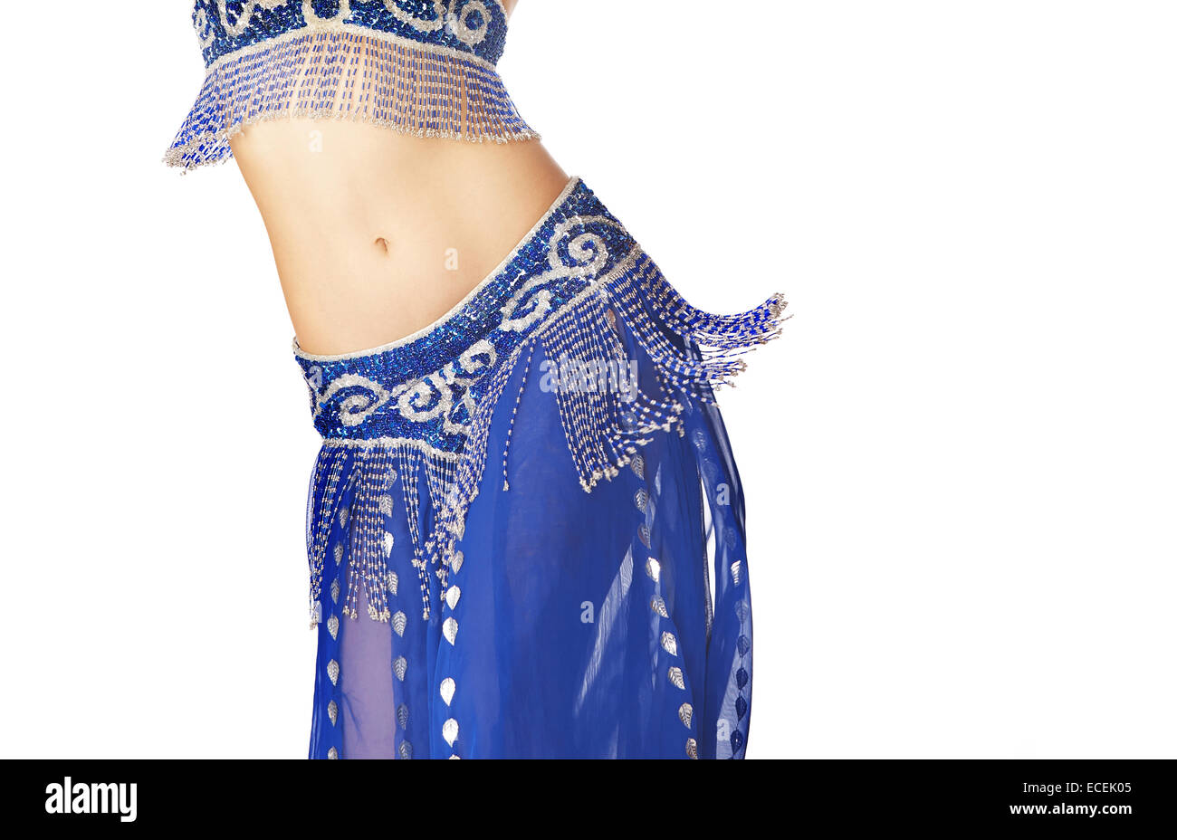 Belly dancer in blue traditional dress on a white background Stock