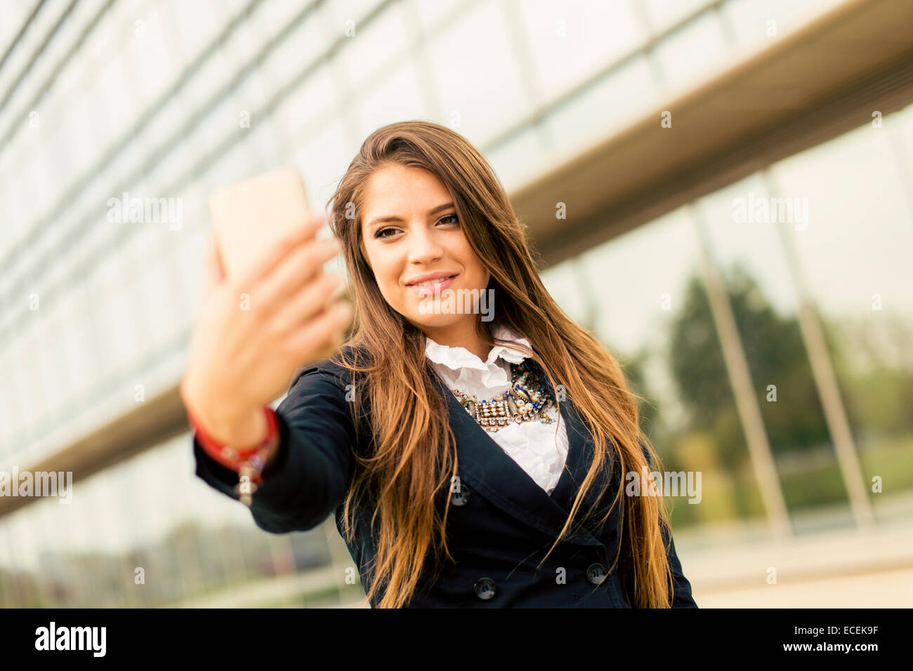 Young woman taking a selfie with mobile phone Stock Photo - Alamy