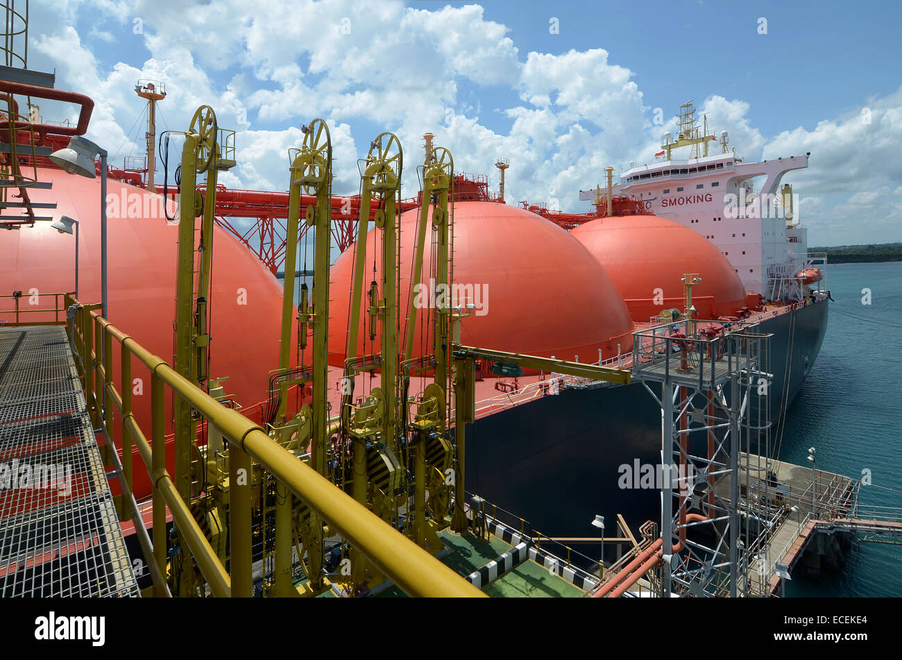 LNG Tanker shipping loading gas in LNG terminal Stock Photo