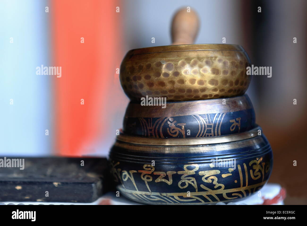 Traditional asian metalware-nepalese painted singing bowls on the windowshop of a handicraft selling souvenir shop.Pokhara-Nepal Stock Photo