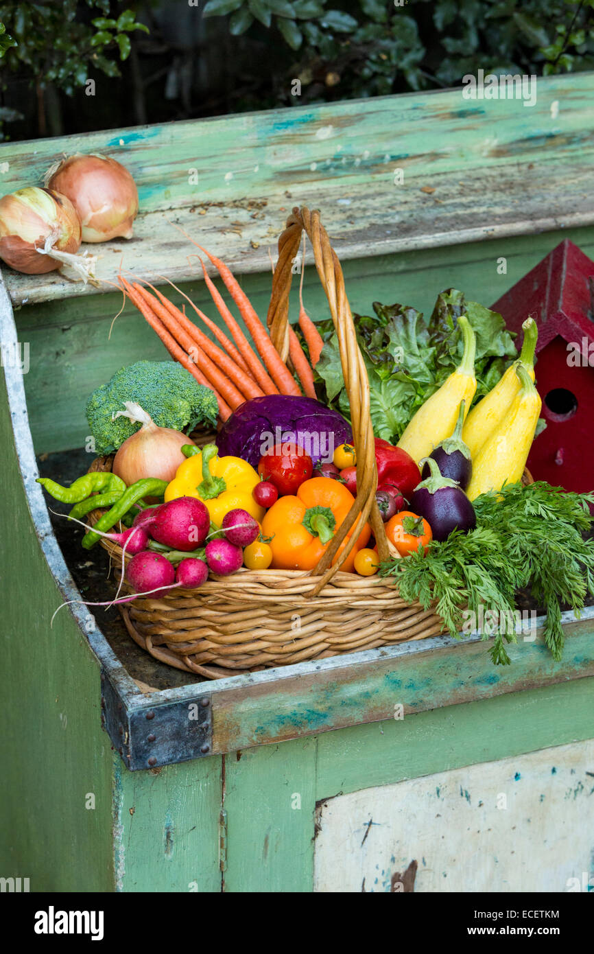 Farm Fresh Produce in basket with birdhouse Stock Photo