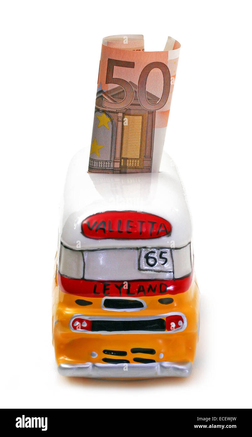 Piggy bank with the shape of bus tour of Malta with fifty euro. Stock Photo