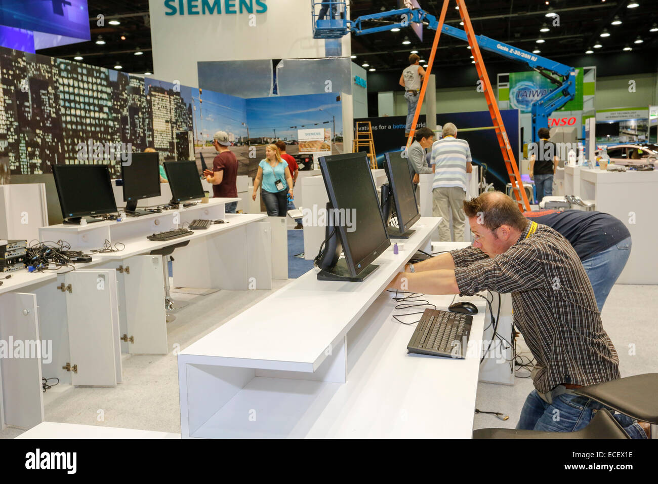 Detroit, Michigan - Workers prepare displays in the exhibit hall for the Intelligent Transport Systems World Congress. Stock Photo