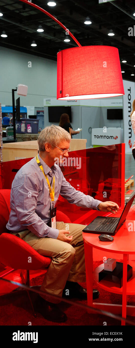 Detroit, Michigan - A participant in the Intelligent Transport Systems World Congress works on a laptop in the exhibit hall. Stock Photo