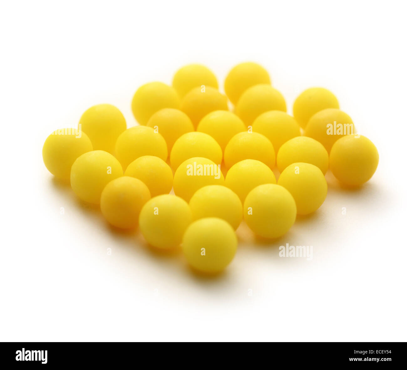 Heap of yellow vitamin pills Stock Photo