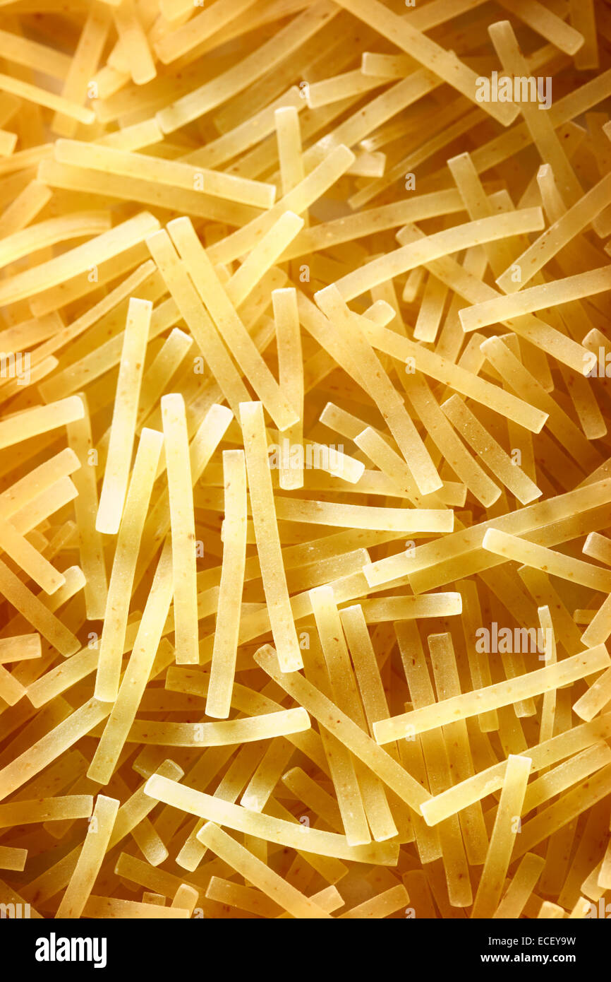 Short thin pasta tubes as background Stock Photo Alamy