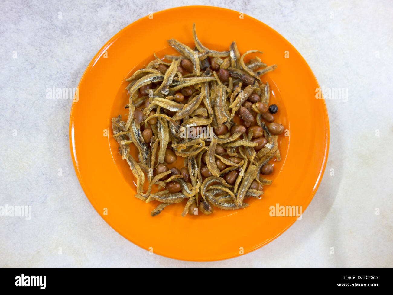 Dried and fried small Anchovy fish with peanuts Stock Photo