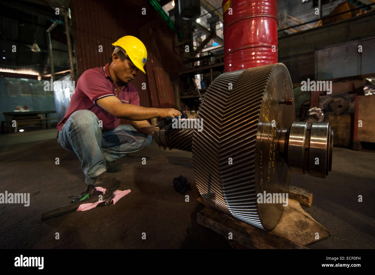 Man working on machinery in sugar mill Stock Photo