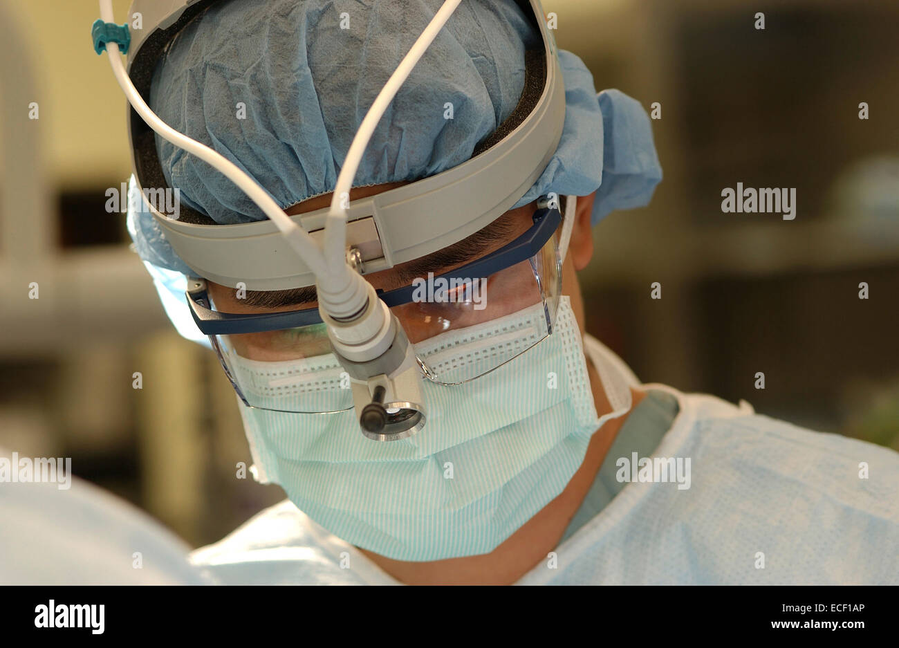 Surgeon wearing a mask during surgery. Stock Photo