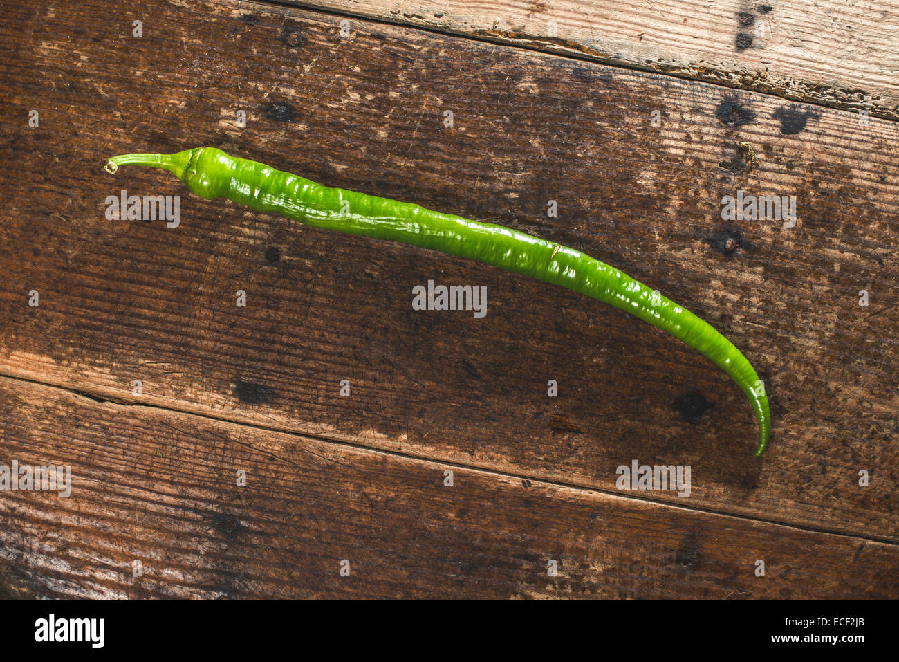 Green long pepper on wood Stock Photo Alamy